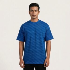 Cobalt blue oversized tee with an all-over geometric print for a subtle textured look. Relaxed, dropped-shoulder fit in soft premium cotton — a streetwear staple that pairs effortlessly with black bottoms.